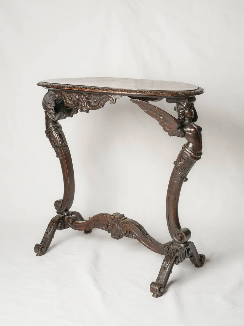 Napoléon III French beech oval side table w/ winged caryatids