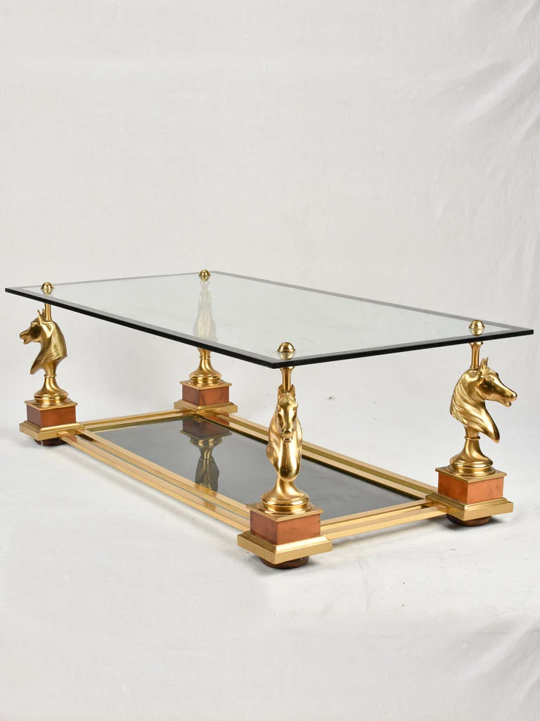 1970s glass coffee table with horse heads 47¾"