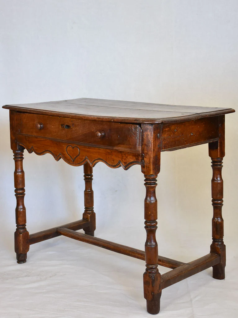 Louis XIII walnut side table with drawer and heart motif