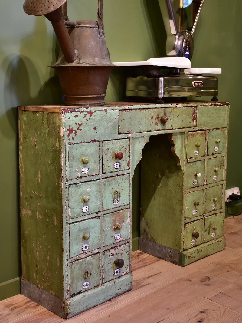 Set of small merchant's drawers with green patina