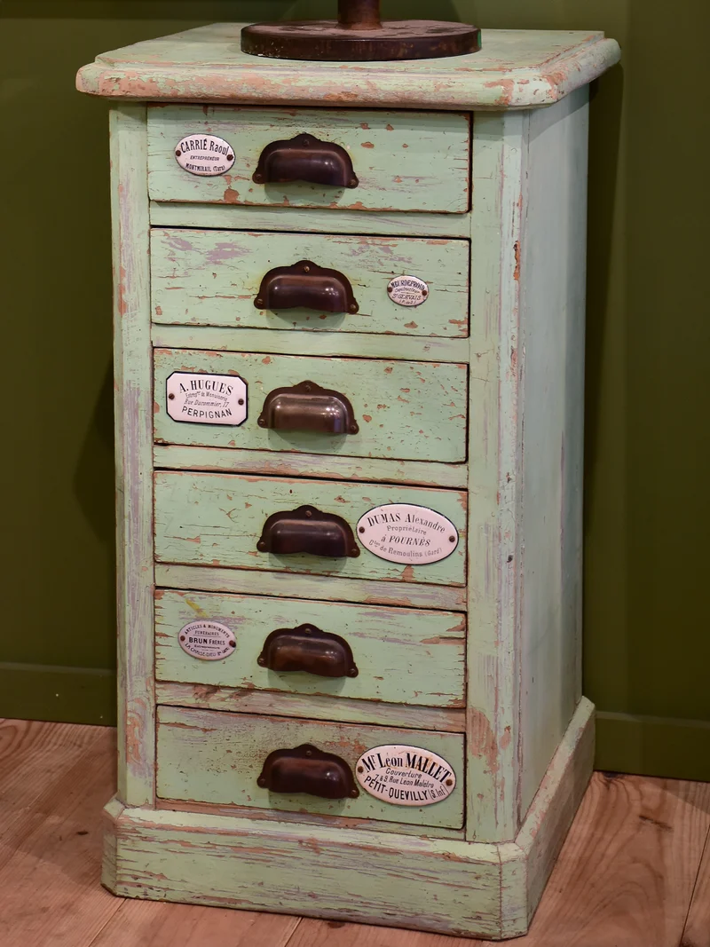 Set of small merchant's drawers with green patina