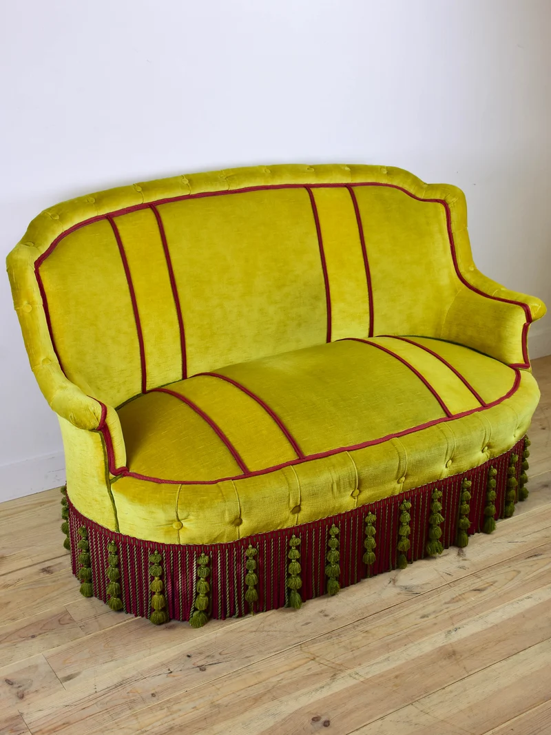 Naooleon III sofa with yellow and pink upholstery and fringe