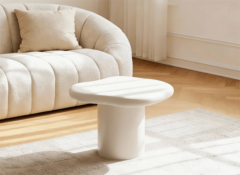 Table basse ronde en béton brossé blanc plateau asymétrique ZELINE